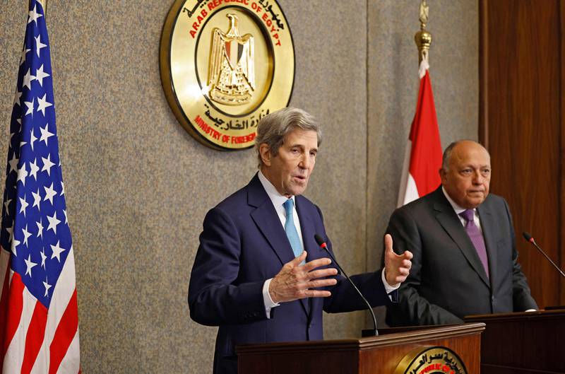 Egypt’s Foreign Minister Sameh Shoukry, right, and the US climate envoy John Kerry hold a joint press conference in Cairo on Monday. AFP