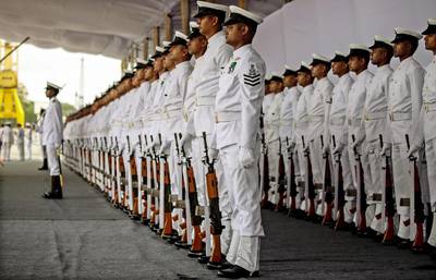 Indian Navy personnel perform a display during the commissioning ceremony for India's largest indigenously built warship, Indian Naval Ship (INS) Kolkata, a guided-missile destroyer, at the Naval Dockyard in Mumbai, India.  Divyakant Solanki / EPA