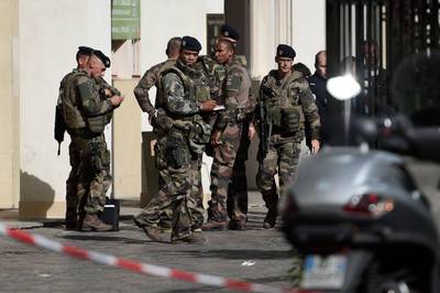French soldiers gather at the site where a car injured six soldiers on patrol in Levallois-Perret. Stephane De Sakutin.