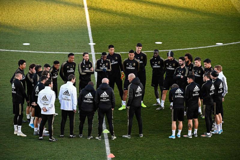 Real Madrid manager Zinedine Zidane talks to his players. AFP