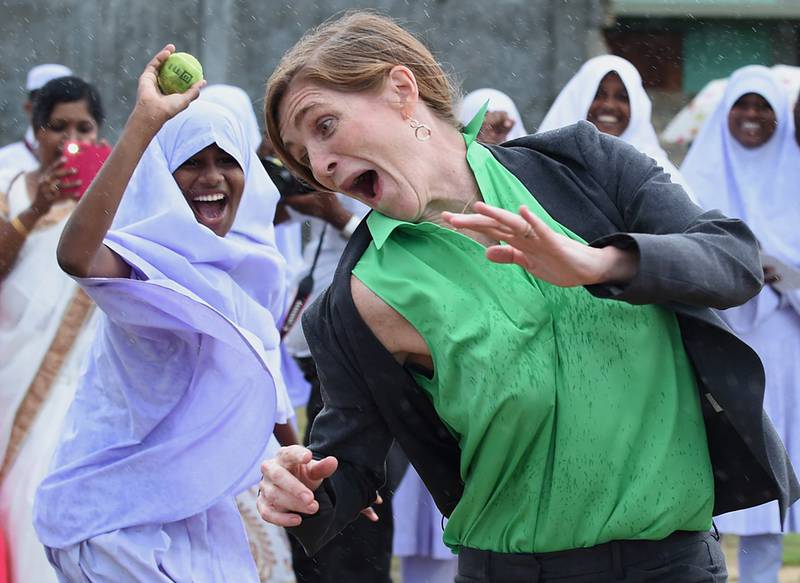 USAID chief Samantha Power plays the Sri Lankan bat and ball game called Elle with girls at Osmaniay College in Jaffna. AFP