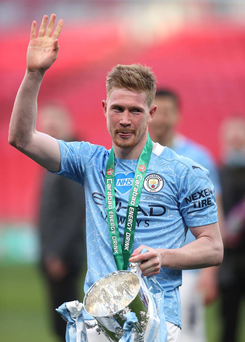 Kevin De Bruyne of Manchester City celebrates with the League Cup trophy following their side's victory in the final over Tottenham Hotspur. Getty