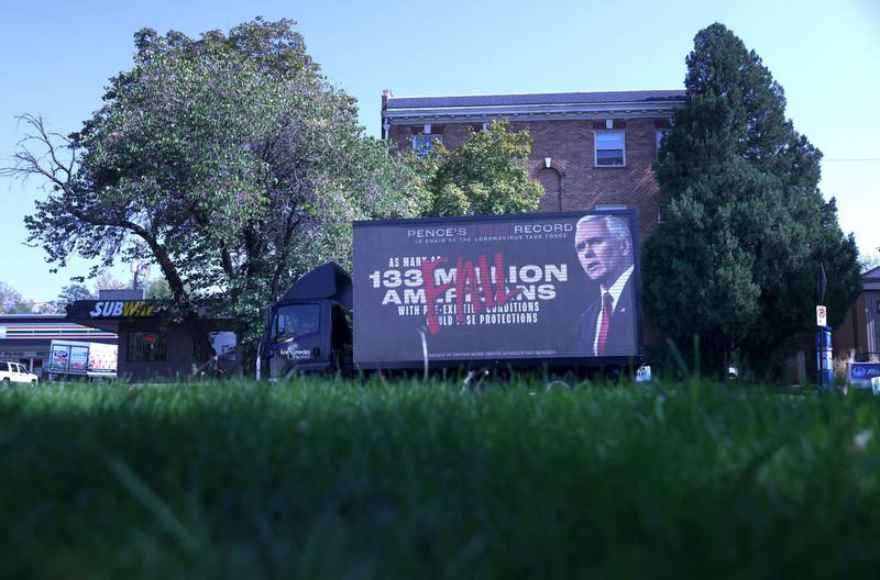 A mobile billboard sponsored by the Democratic National Committee criticising the 
adminsitration's Covid19 response. AFP