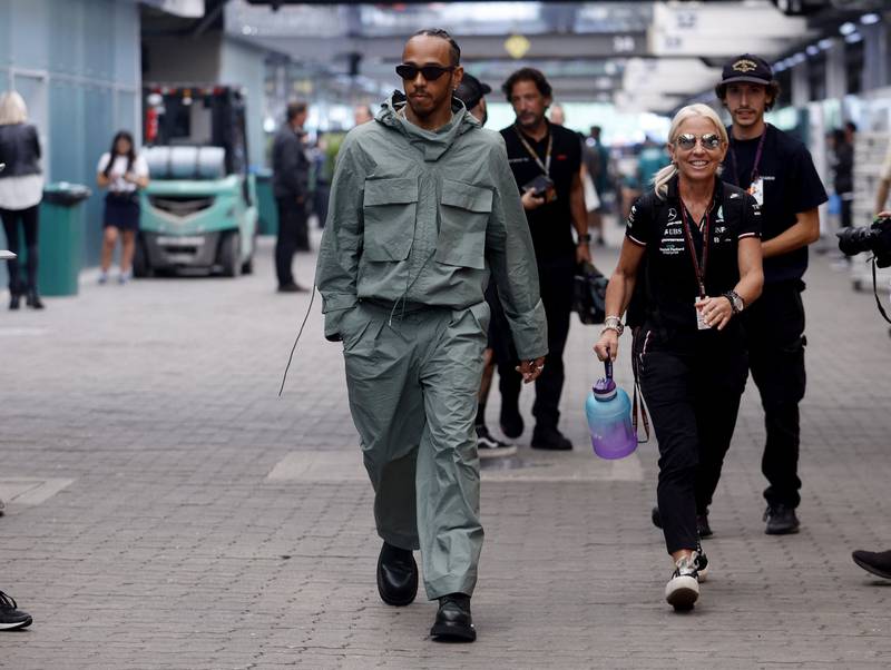 Lewis Hamilton, in a khaki boiler suit by Craig Green, arrives at the Brazilian Grand Prix in Sao Paulo on November 10, 2022. Reuters