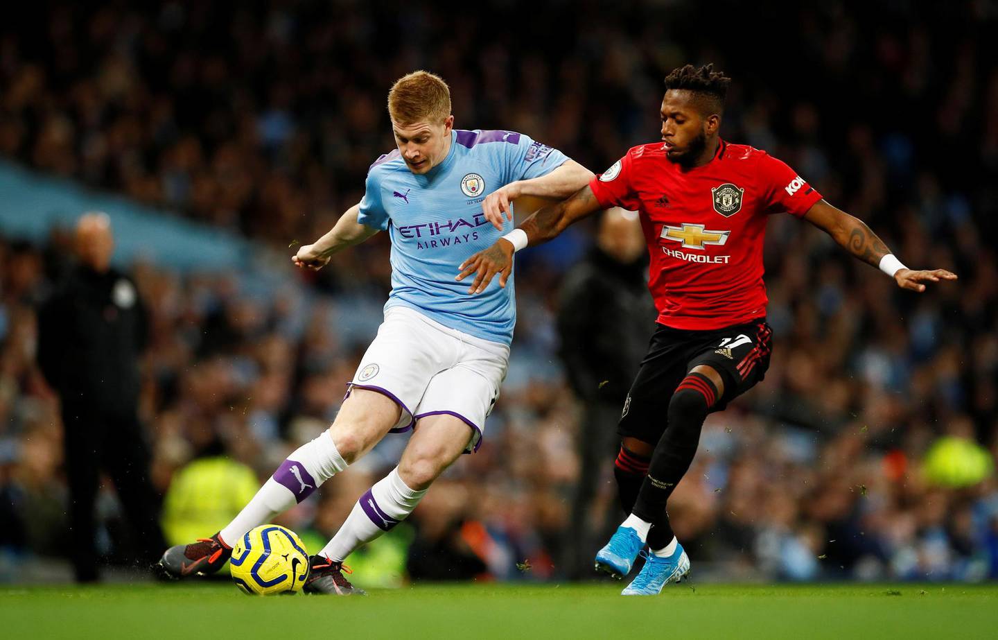 Soccer Football - Premier League - Manchester City v Manchester United - Etihad Stadium, Manchester, Britain - December 7, 2019  Manchester City's Kevin De Bruyne in action with Manchester United's Fred  Action Images via Reuters/Jason Cairnduff  EDITORIAL USE ONLY. No use with unauthorized audio, video, data, fixture lists, club/league logos or "live" services. Online in-match use limited to 75 images, no video emulation. No use in betting, games or single club/league/player publications.  Please contact your account representative for further details.