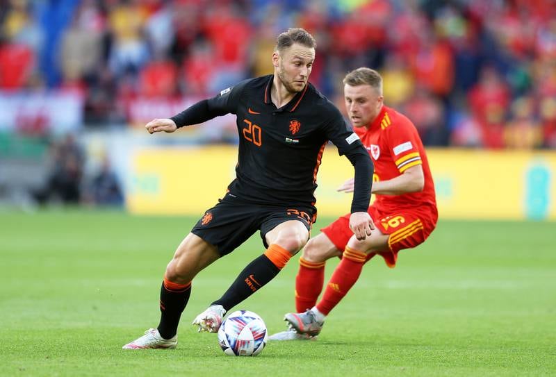 Teun Koopmeiners of Netherlands battles for possession with Joe Morrell of Wales. Getty Images