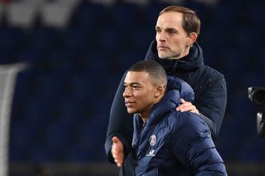 Paris Saint-Germain's French forward Kylian Mbappe celebrates with German coach Thomas Tuchel. AFP