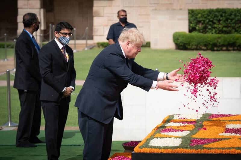 The British prime minister lays a wreath at the memorial in Raj Ghat. Getty Images