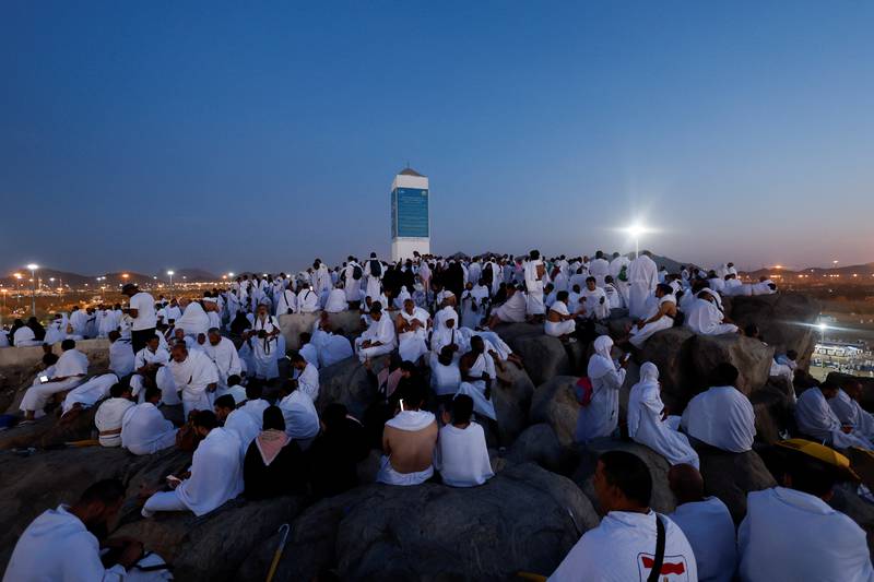 Pilgrims gather on Mount of Mercy. Reuters
