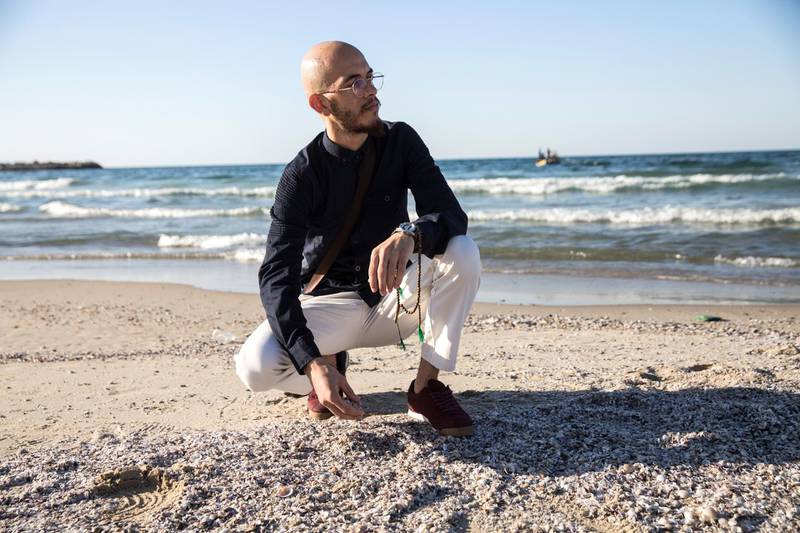 Mohamed Nafez Hamed,22, at the beach in Gaza City on November 2,2018.His older brother Sajed Hamed and another colleague decided to try their luck outside Gaza. Back then Rafah was closed, so they were smuggled through the tunnels to Egypt and then set out on a boat from Alexandria to Italy.  The boat crashed. Mohamed��s family hasn��t heard from Sajed since. (Photo by Heidi Levine for The National).