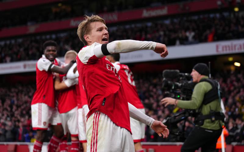 Arsenal's Martin Odegaard celebrates after teammate Leandro Trossard's goal.  PA