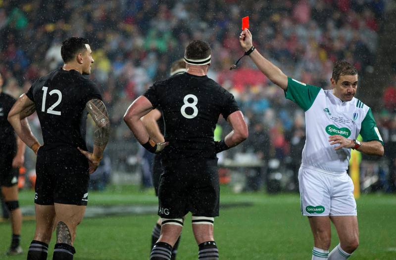 French referee Jerome Garces, right, shows a red card to All Blacks' inside centre Sonny Bill Williams, left, to send him from the field as captain Kieran Read watches during the second Test against the British & Irish Lions in Wellington on July 1. Brett Phibbs / AP Photo