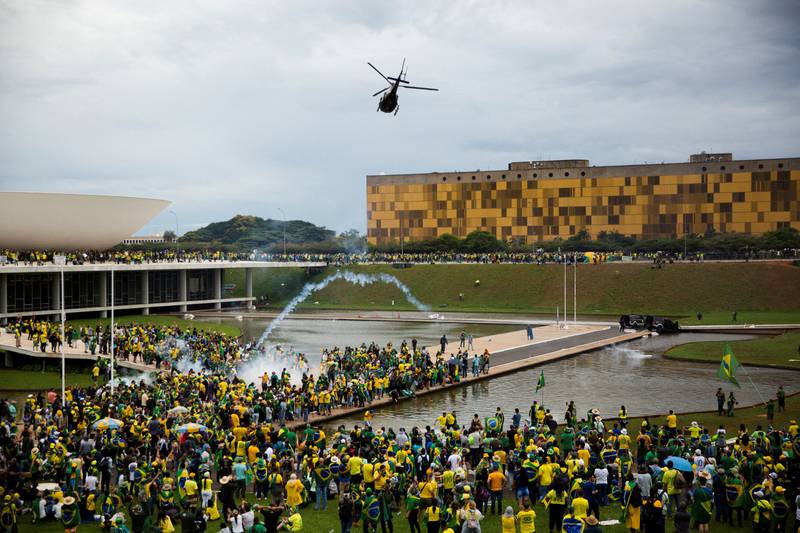 Supporters of Brazil's former president Jair Bolsonaro demonstrate against President Luiz Inacio Lula da Silva in Brasilia. Protesters pushed through police barricades and stormed into the Congress, presidential palace and Supreme Court buildings on Sunday. Reuters
