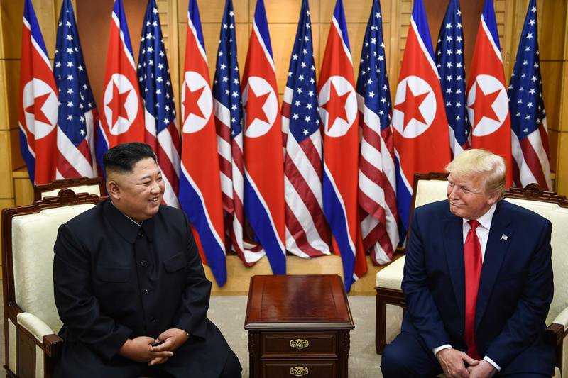 US President Donald Trump talks with North Korean leader Kim Jong-un. AFP