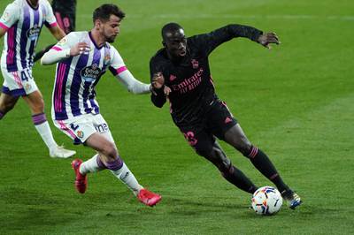 Real Madrid defender Ferland Mendy vies with Real Valladolid's Luis Perez. AFP