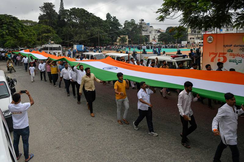 A huge Indian flag is carried in a procession, as part of Independence Day celebrations in Bangalore. AFP