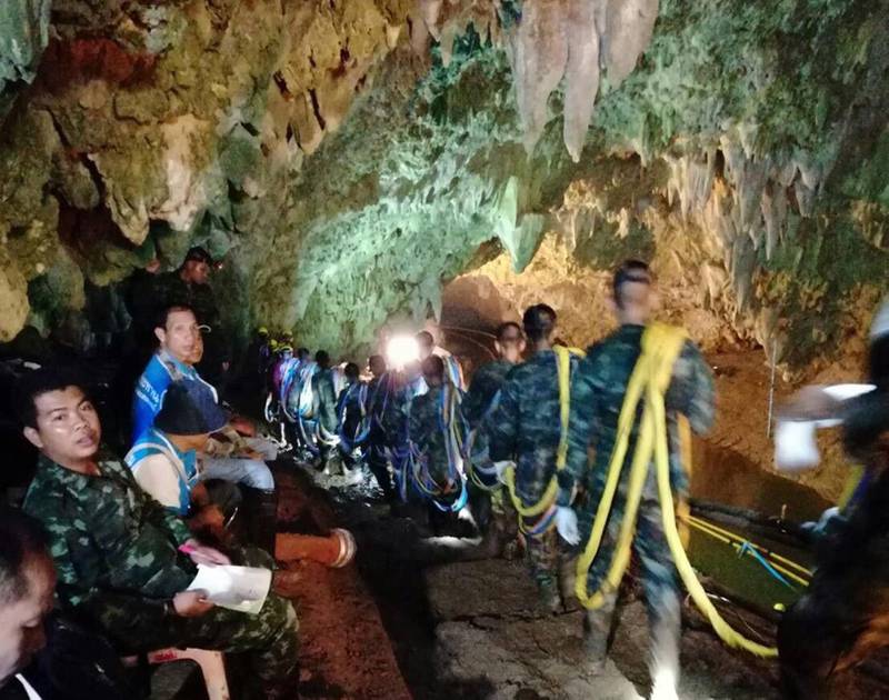 epa06858325 An undated handout photo released by Royal Thai Army on 02 July 2018 shows Thai soldiers loading cables in the cave complex during a rescue operation for a missing youth soccer team and their coach at Tham Luang cave in Khun Nam Nang Non Forest Park, Chiang Rai province, Thailand. Rescuers are attempting to pump water out of a cave complex in an effort to continue the rescue of 13 young members of a youth soccer team including their coach that are believed to have been trapped in the flooded cave complex since 23 June 2018.  EPA/ROYAL THAI ARMY HANDOUT  HANDOUT EDITORIAL USE ONLY/NO SALES
