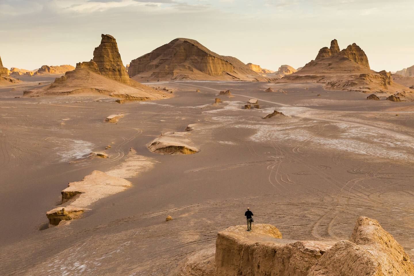 Man aleone in Dasht-e Lut Desert or Lut Desert landscape, a large salt desert in Iran, during sunset. (Photo by: Dani SalvÃ /VWPics/Universal Images Group via Getty Images)
