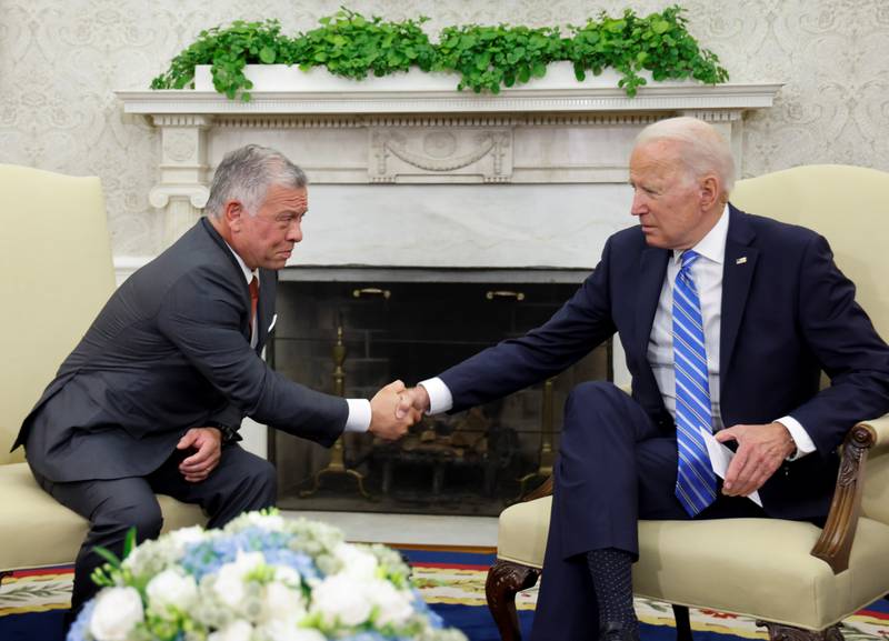 U. S.  President Joe Biden shakes hands with Jordan's King Abdullah II in the Oval Office at the White House in Washington, U. S.
