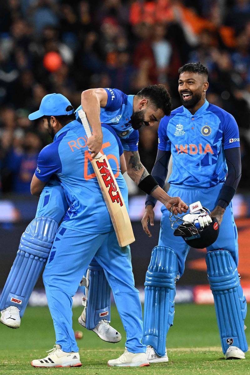 India captain Rohit Sharma lifts Virat Kohli as they celebrate their win over Pakistan in the T20 World Cup in Melbourne. AFP
