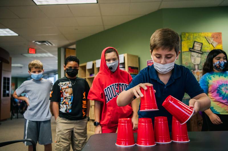 Children wear masks while at school in Houston, Texas. AFP
