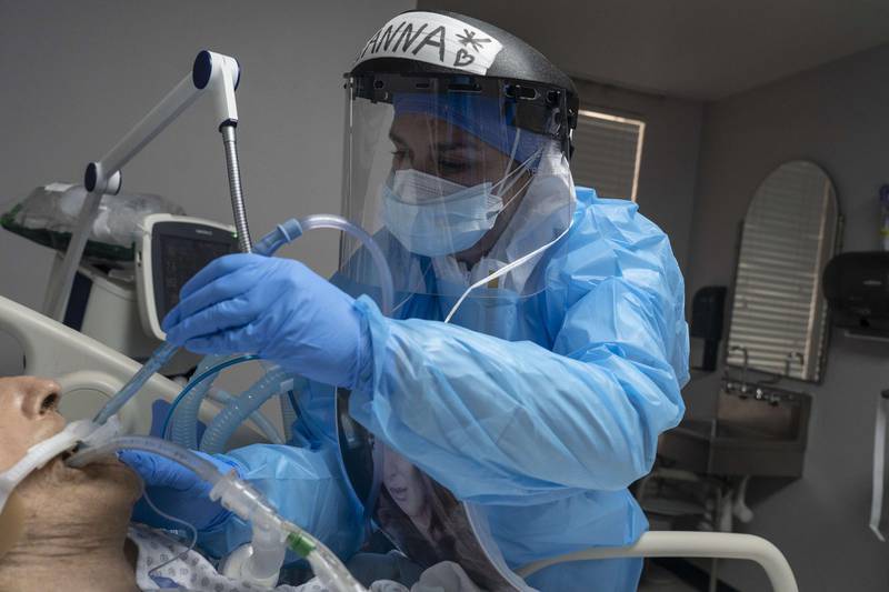 A medical staff member treats a patient suffering from coronavirus in the Covid-19 intensive care unit (ICU) at the United Memorial Medical Center in Houston, Texas. AFP