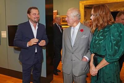 From left, actor Leonardo DiCaprio, Prince Charles and fashion designer Stella McCartney talk on the sidelines of Cop26