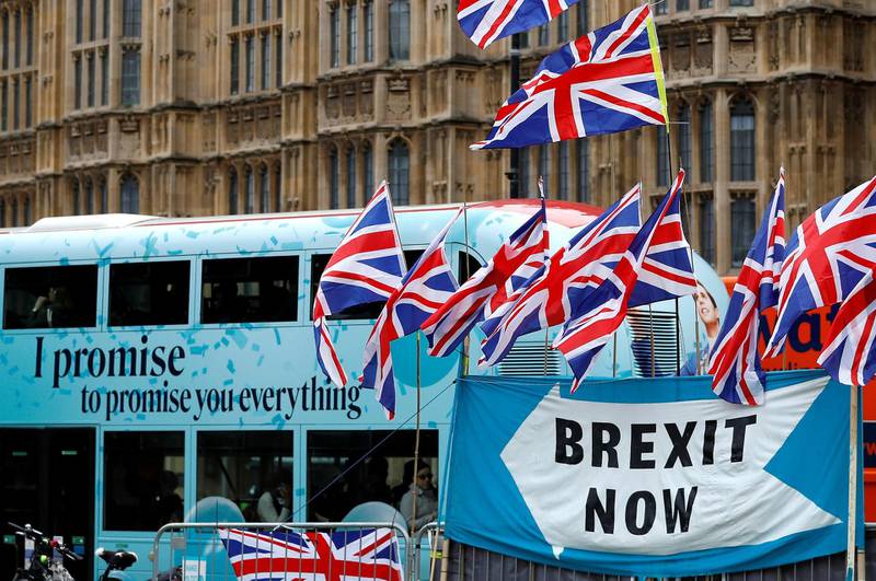 FILE PHOTO: A passenger bus passes a pro-Brexit demonstration in Westminster, London, Britain, September 30, 2019.  REUTERS/Peter Nicholls/File Photo