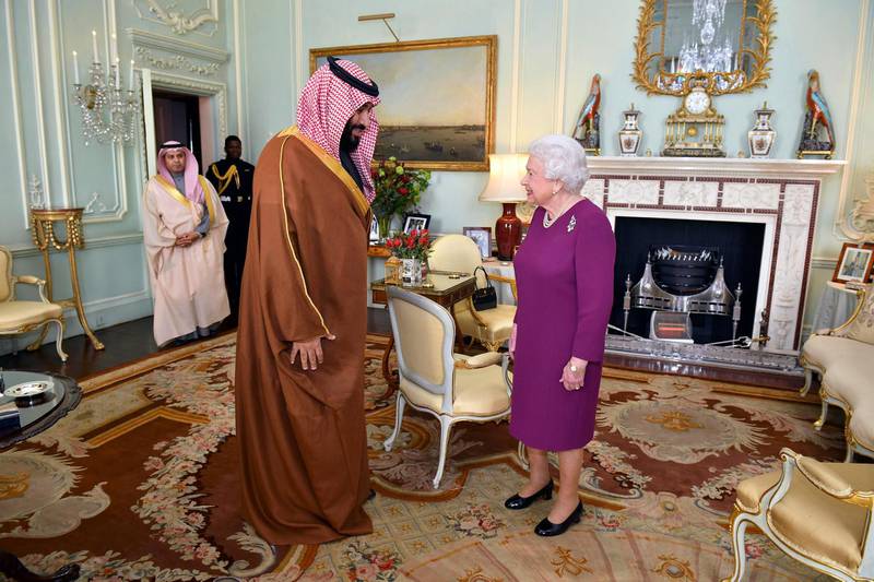 Britain's Queen Elizabeth II greets the Crown Prince of Saudi Arabia Mohammed bin Salman, during a private audience at Buckingham Palace in London, Wednesday March 7, 2018. (Dominic Lipinski/pool via AP)