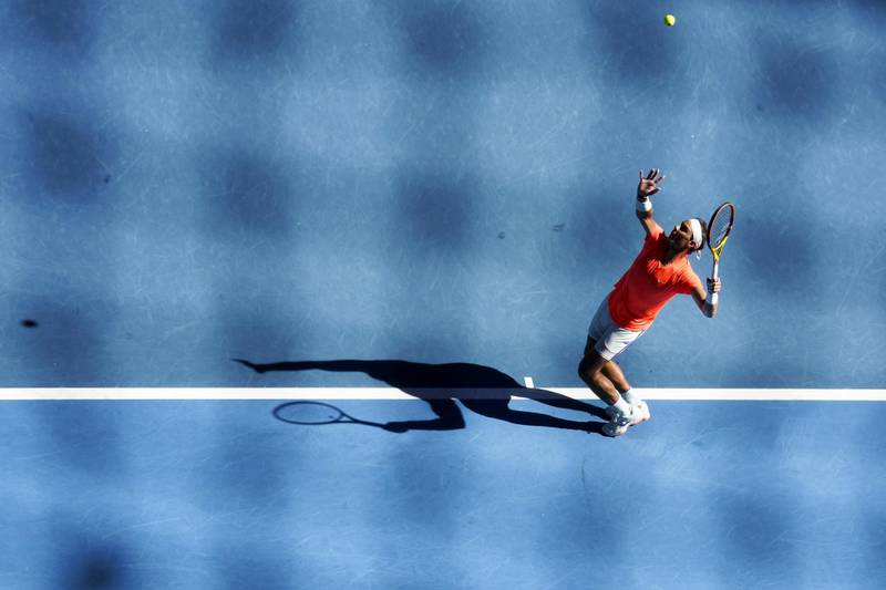 Rafael Nadal hits a serve to Laslo Djere during his first round match at the Australian Open. EPA