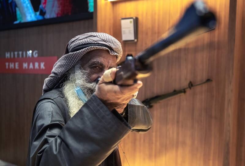 Marksman Ali Mohammat Al Shehhi tests his aim at Adihex. Victor Besa / The National