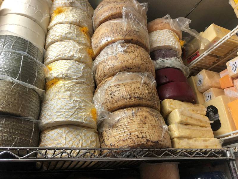Imported European cheeses are seen stored at the Bowers Fancy Dairy Products shop in Washington's Eastern Market several weeks before the Trump administration's tariffs on European Union cheeses are set to kick in across the country and in Washington, U.S. October 3, 2019. Picture taken October 3, 2019.   REUTERS/Kevin Fogarty