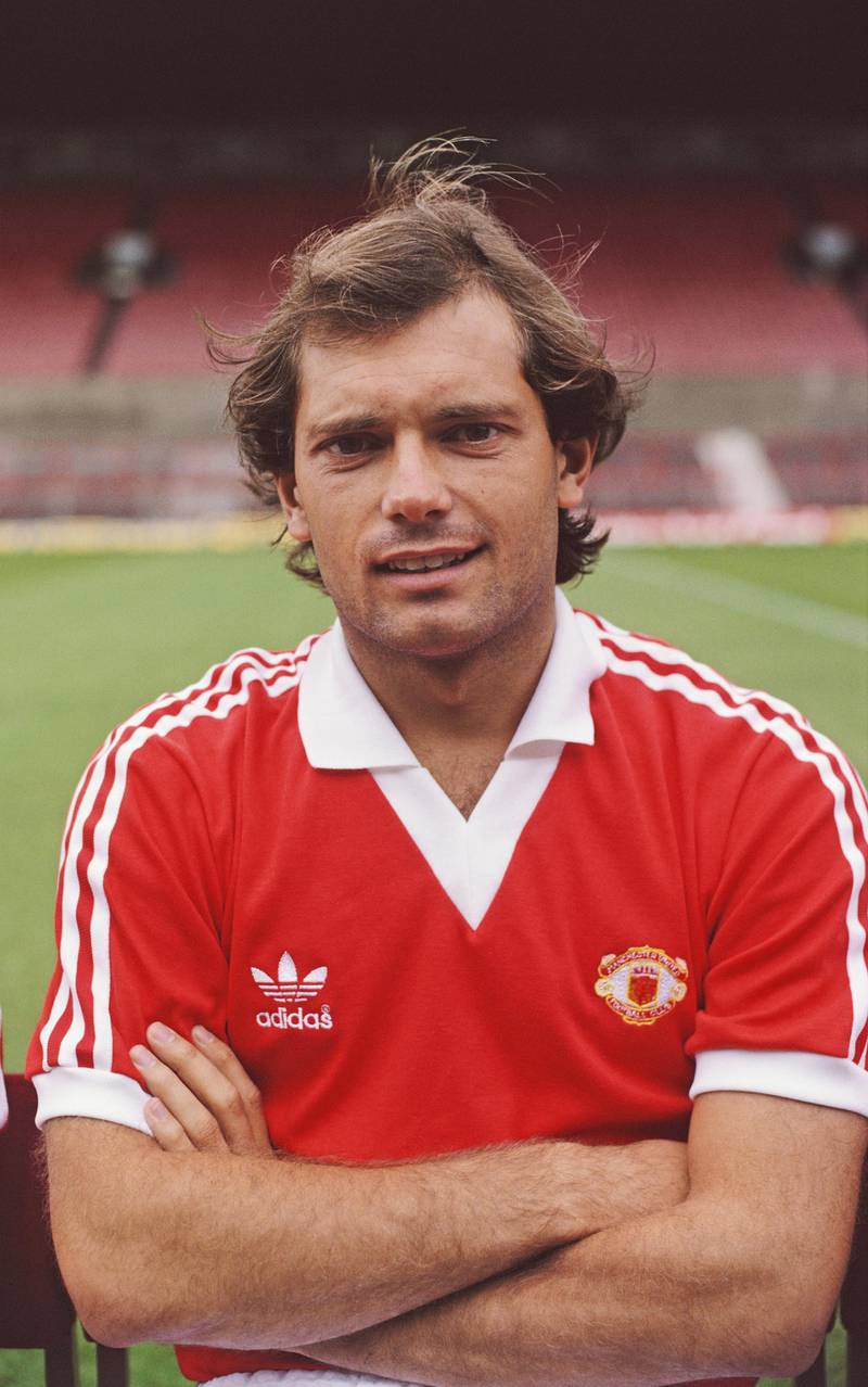 Ray Wilkins, while with Manchester United, poses at the pre season photocall before the 1980/81 season at Old Trafford in Manchester, England. Duncan Raban / Getty Images