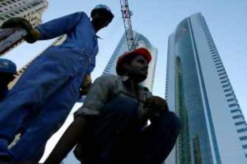 DUBAI-MAY 21,2008 - Construction worker sits on to of the steel bars in Dubai Marina. (Paulo Vecina/The National ) *** Local Caption ***  PV workers 5.jpgPV workers 5.jpg