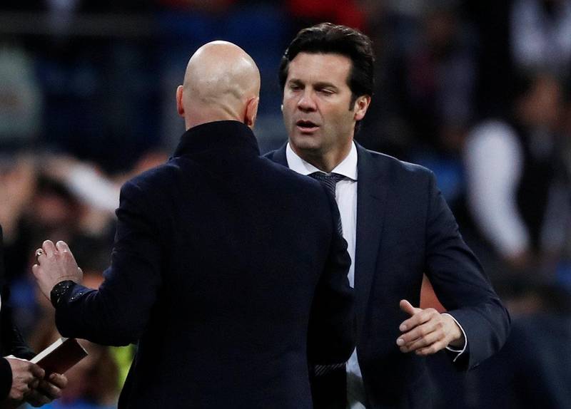 Real Madrid coach Santiago Solari shakes hands with Ajax coach Erik ten Hag. Reuters