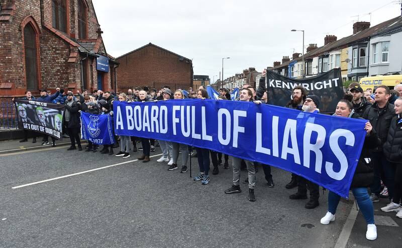 Everton fans stage a protest against the club board before the match. EPA