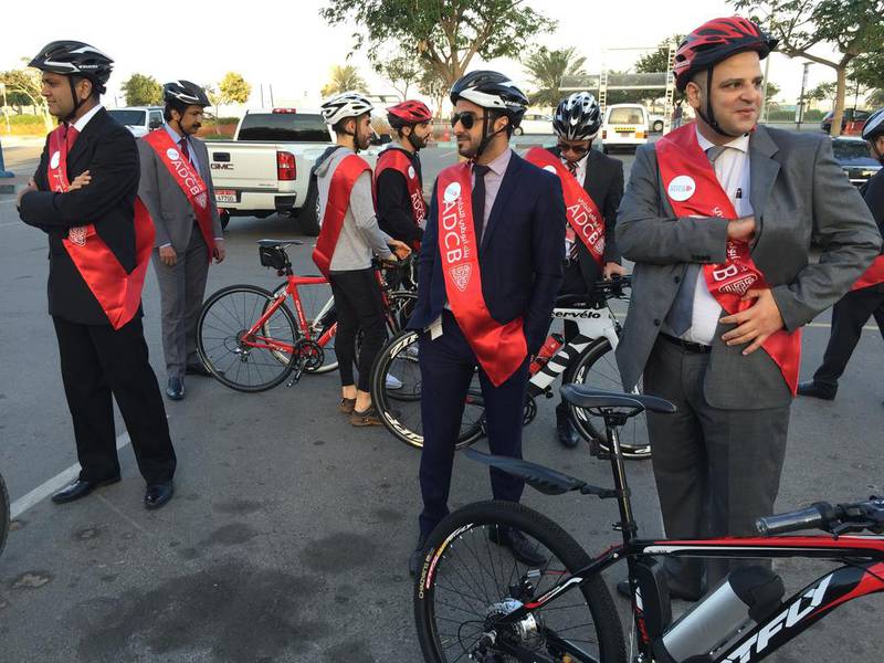 Cyclists from ADCB get ready to cycling into work in Abu Dhabi. Christopher Pike / The National