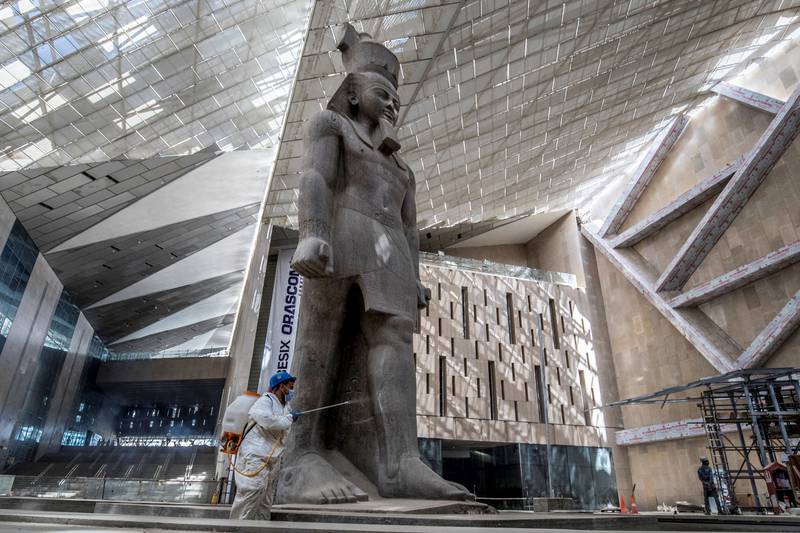 The 3,200-year-old pink granite statue of King Ramses II, at the entrance of the the Grand Egyptian Museum in Giza, on the south-western outskirts of Cairo. AFP