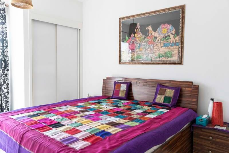 One of the bedrooms. The interiors are both rustic and contemporary, with many artworks from India on the walls. 

