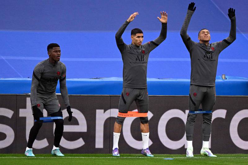 Portuguese defender Nuno Mendes, Moroccan defender Achraf Hakimiand and French forward Kylian Mbappe working out.  AFP