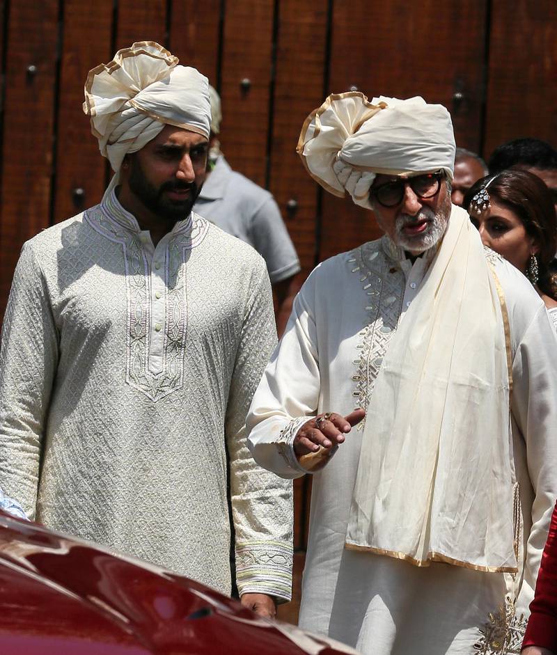 Father-son Amitabh Bachchan (R) and Abhishek Bachchan (L) leave after attending the wedding ceremony of his sister and Bollywood actress Sonam Kapoor in Mumbai, India, 08 May 2018. The 32-year-old actress got married to Indian  businessman Anand Ahuja in a sikh wedding at her aunt's mansion Rockdale.  EPA/DIVYAKANT SOLANKI