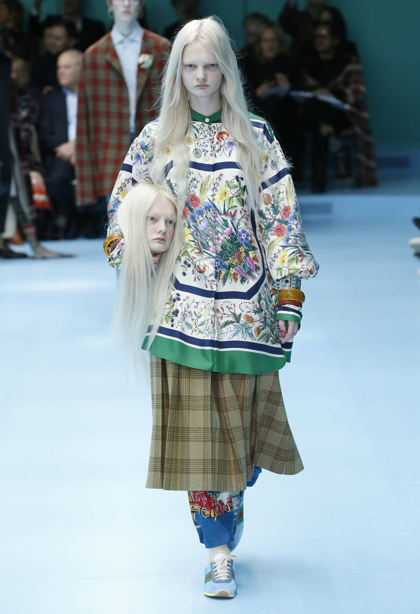Models carry their own heads at the Gucci autumn/winter 2018 women's show at Milan Fashion Week. Photo: Gucci