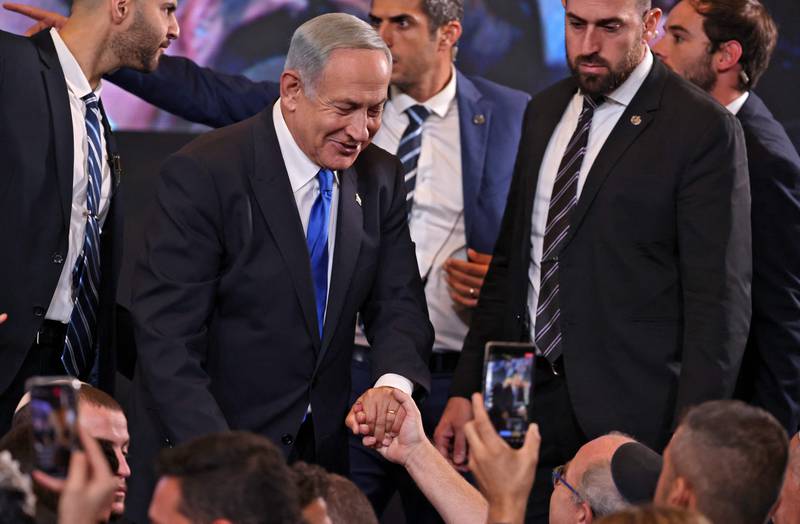 Mr Netanyahu greets supporters after the end of voting for the national elections. AFP