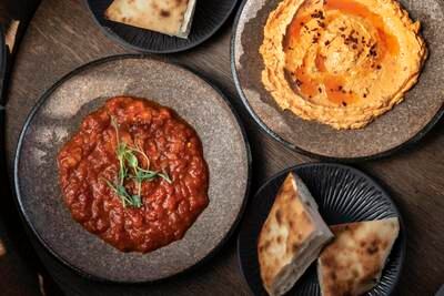 The ajvar vegetable preserve, made of chargrilled sweet red peppers, garlic and chilli peppers, is a must-try dip. Antonie Robertson / The National