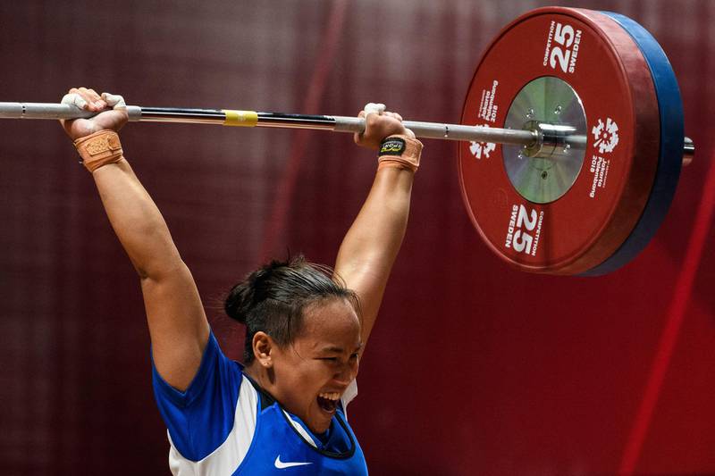 Philippines' Elreen Ann Ando takes part in the women's 63kg weightlifting. Anthony Wallace / AFP