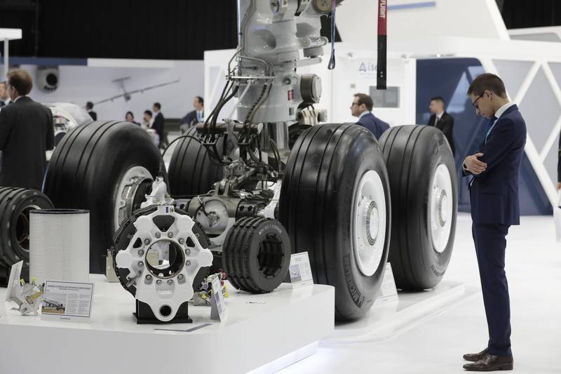 An attendee inspects Michelin aircraft tyres on Safran SA landing gear. Bloomberg