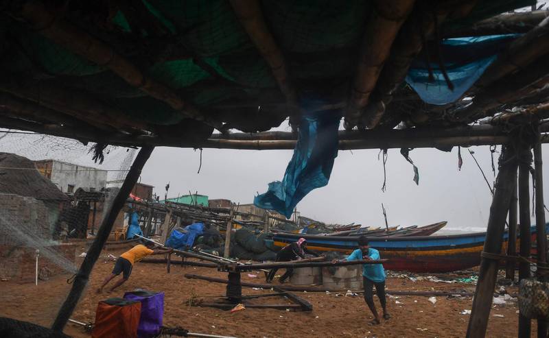 Indian fishermen batten down the hatches in preparation for an approaching cyclone on a beach in Puri in the eastern Indian state of Odisha in May, 2019. AFP
