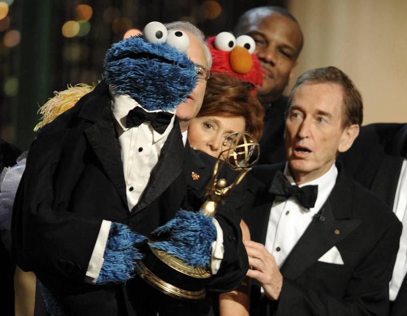 FILE - Bob McGrath, right, looks at the Cookie Monster as they accept the Lifetime Achievement Award for '"Sesame Street" at the Daytime Emmy Awards on Aug.  30, 2009, in Los Angeles.  McGrath, an actor, musician and children’s author widely known for his portrayal of one of the first regular characters on the children’s show “Sesame Street” has died at the age of 90.  McGrath’s passing was confirmed by his family who posted on his Facebook page on Sunday, Dec.  4, 2022.  (AP Photo / Chris Pizzello, File)