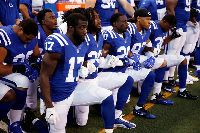 FILE PHOTO:    Sep 24, 2017; Indianapolis, IN, USA; Indianapolis Colts players kneel during the playing of the National Anthem before the game against the Cleveland Browns at Lucas Oil Stadium. Mandatory Credit: Brian Spurlock-USA TODAY Sports/File Photo
