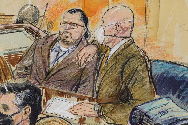This artist sketch depicts Guy Wesley Reffitt, left, and his lawyer, William Welch, right, in federal court in Washington. Dana Verkouteren via AP